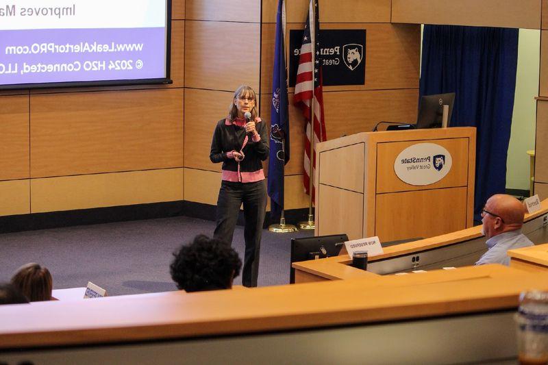 woman speaking to audience